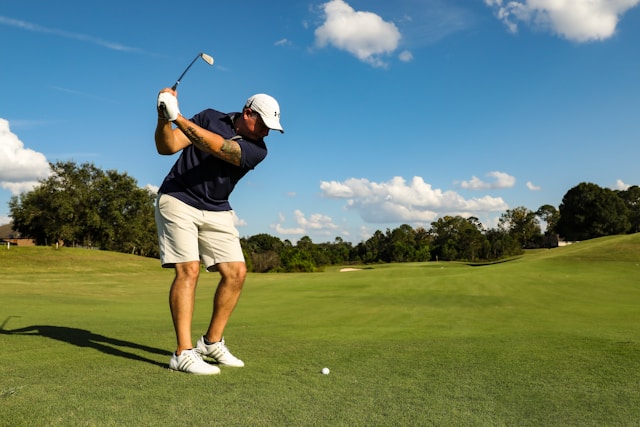 a man playing golf in a golf course